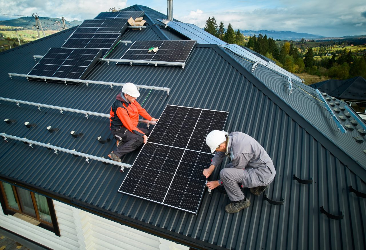 technician installation of solar panel